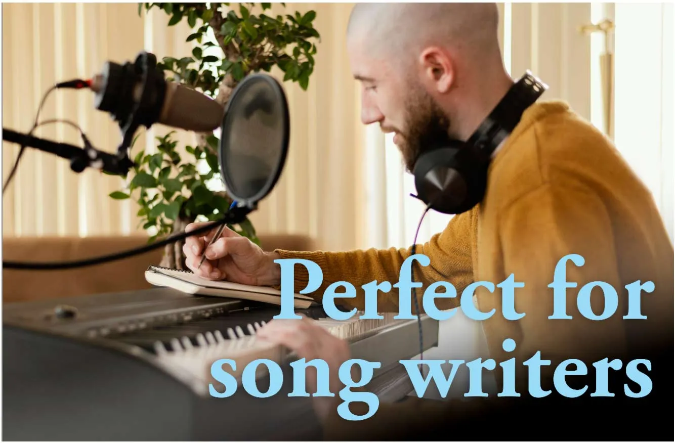 A songwriter with headphones writing at a keyboard